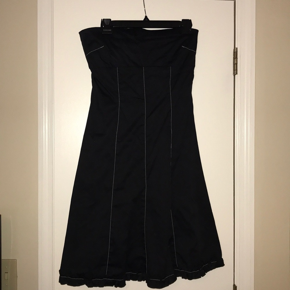 Strapless black dress with white stitching